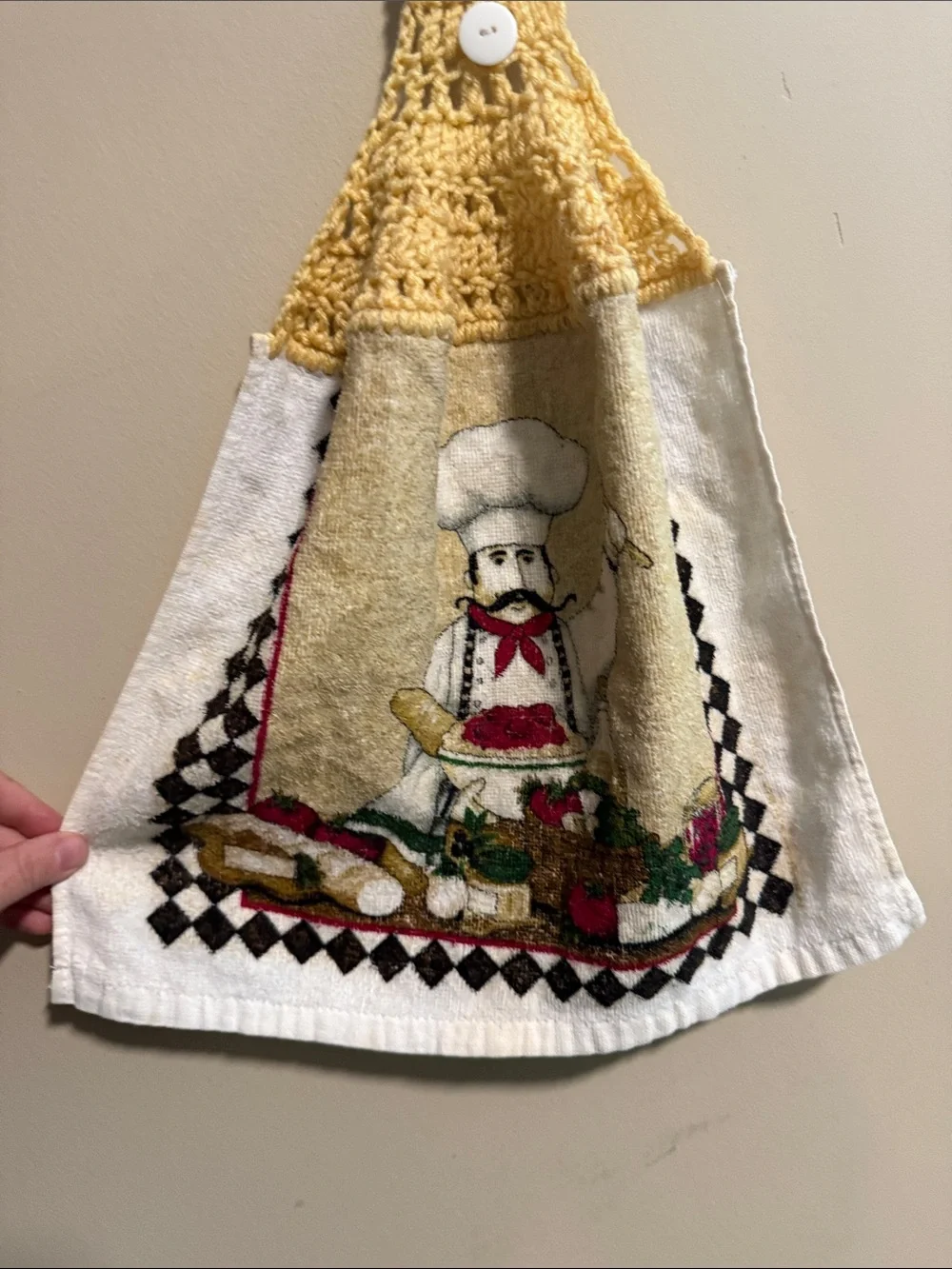 Vintage handmade yellow-topped crochet hanging kitchen towel featuring a chef